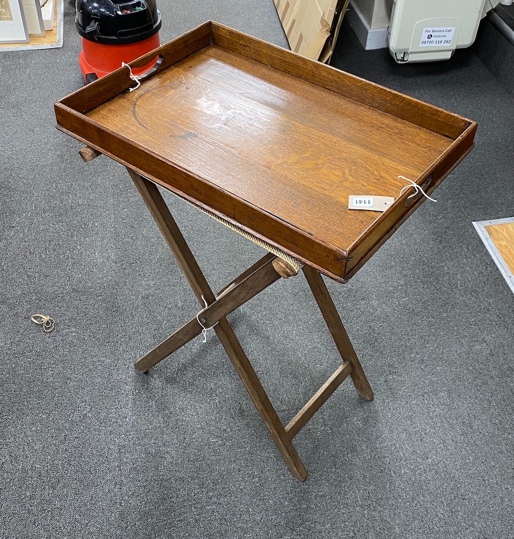 A Victorian oak butler’s tray and stand, 79.5 cm high on the stand, length 62cm, width 43cm